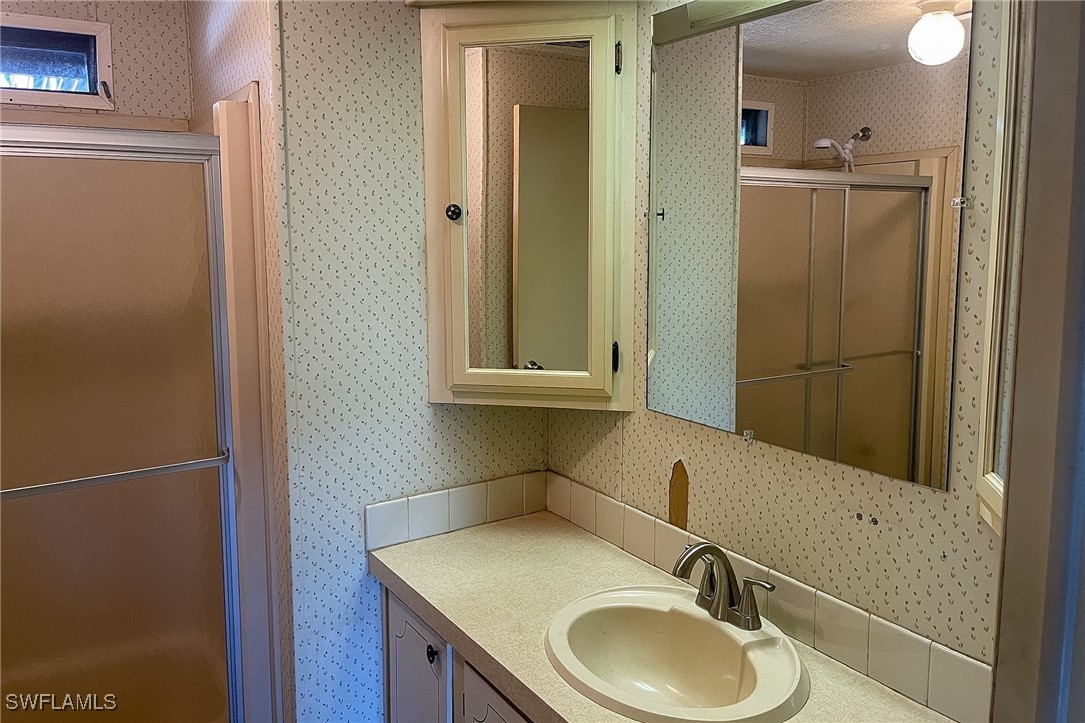 22 Ashe Alva, FL 33920 - Photo 16 of 42 a bathroom with a sink and a mirror