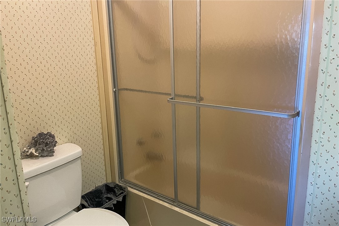 22 Ashe Alva, FL 33920 - Photo 18 of 42 a bathroom with a shower toilet and sink