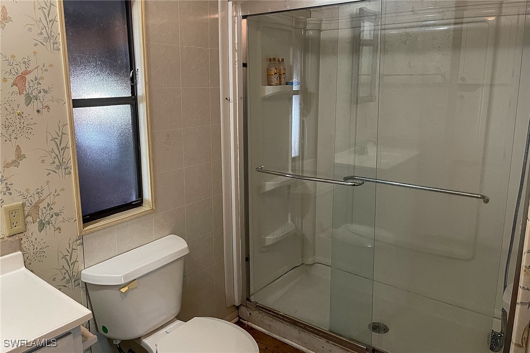 22 Ashe Alva, FL 33920 - Photo 21 of 42 a bathroom with a shower and a toilet