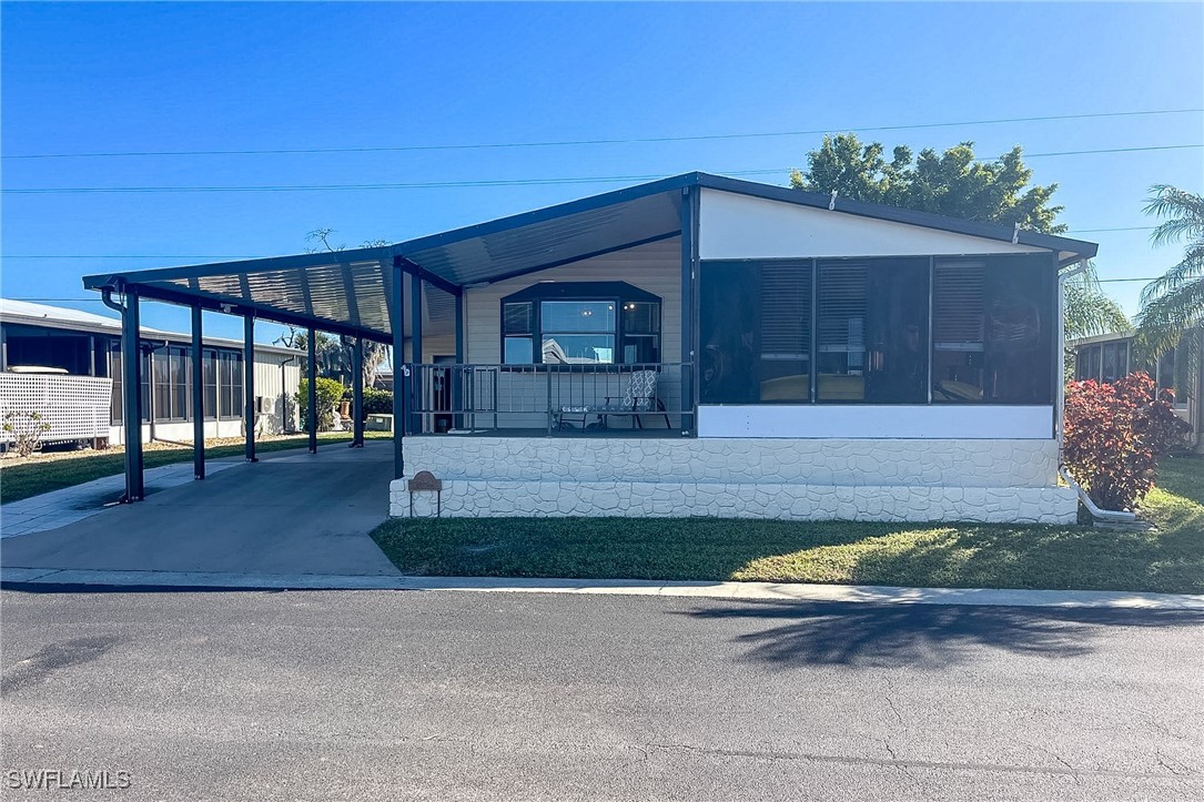 22 Ashe Alva, FL 33920 - Photo 22 of 42 a front view of a house with a yard