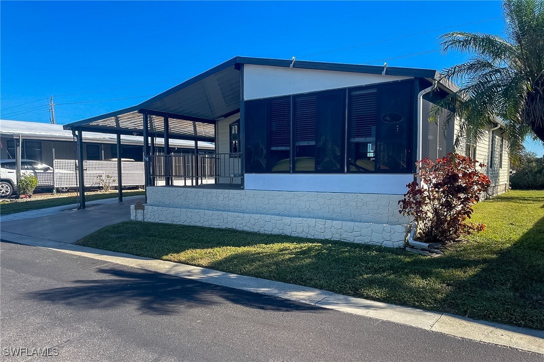 22 Ashe Alva, FL 33920 - Photo 25 of 42 a front view of a house having yard