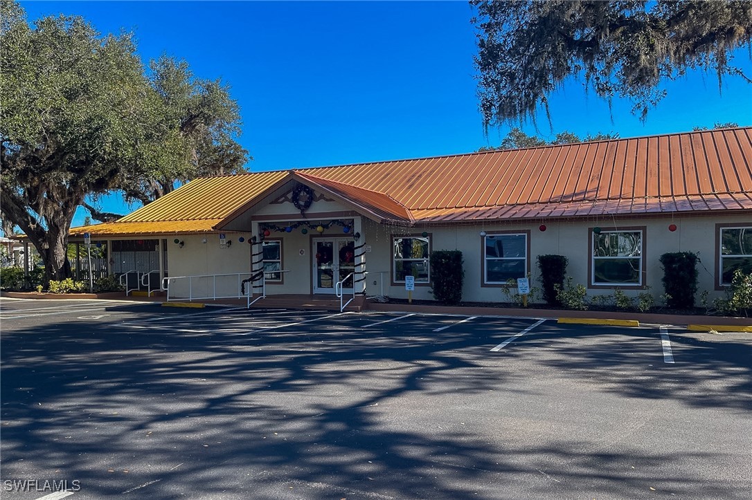 22 Ashe Alva, FL 33920 - Photo 27 of 42 a front view of a house with a garden