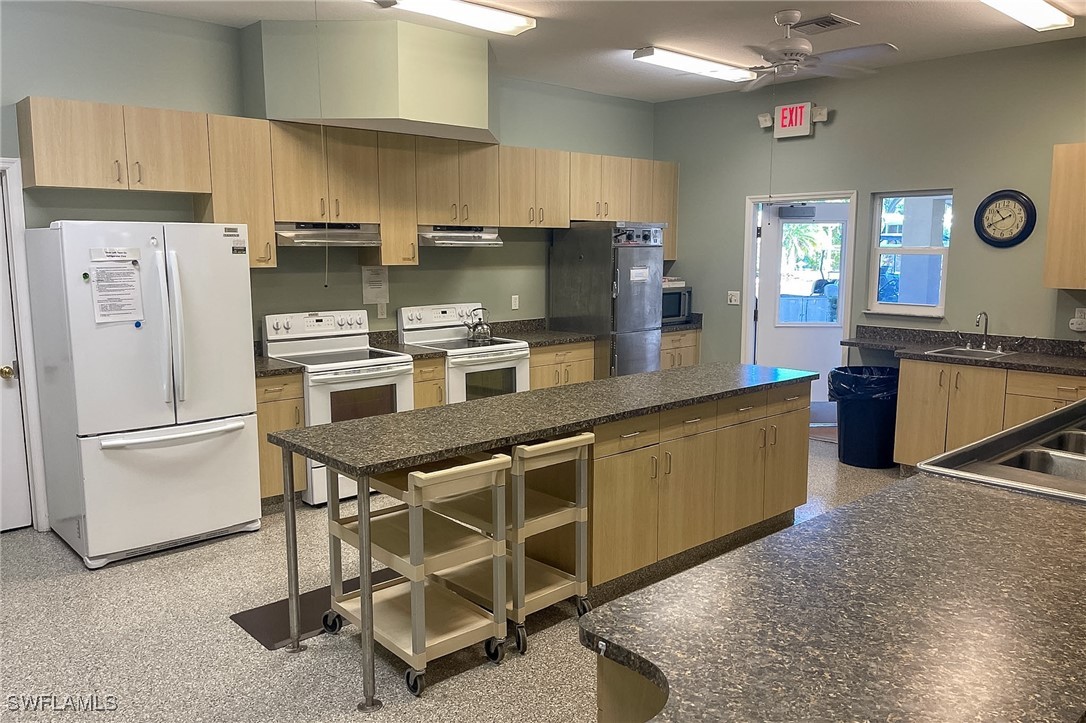 22 Ashe Alva, FL 33920 - Photo 29 of 42 a kitchen with stainless steel appliances granite countertop a stove refrigerator sink and microwave