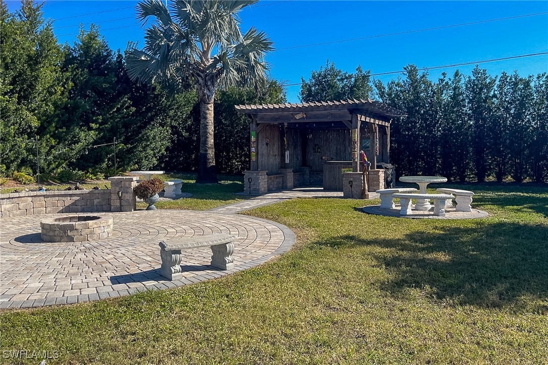 22 Ashe Alva, FL 33920 - Photo 34 of 42 a view of a house with backyard and sitting area