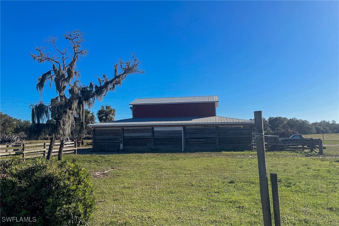 22 Ashe Alva, FL 33920 - Photo 40 of 42 a front view of a house with a yard