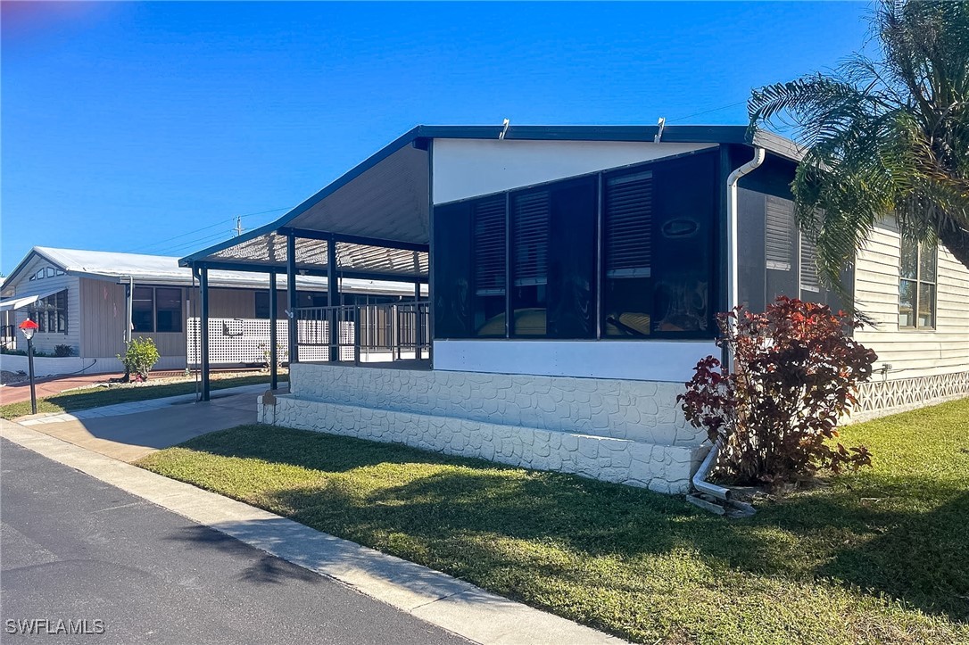 22 Ashe Alva, FL 33920 - Photo 41 of 42 a house view with a garden space