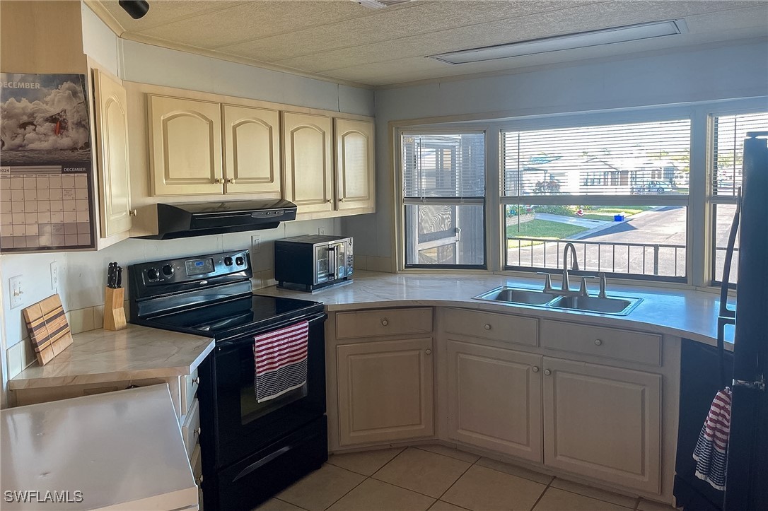 22 Ashe Alva, FL 33920 - Photo 7 of 42 a kitchen with granite countertop cabinets stainless steel appliances and a sink