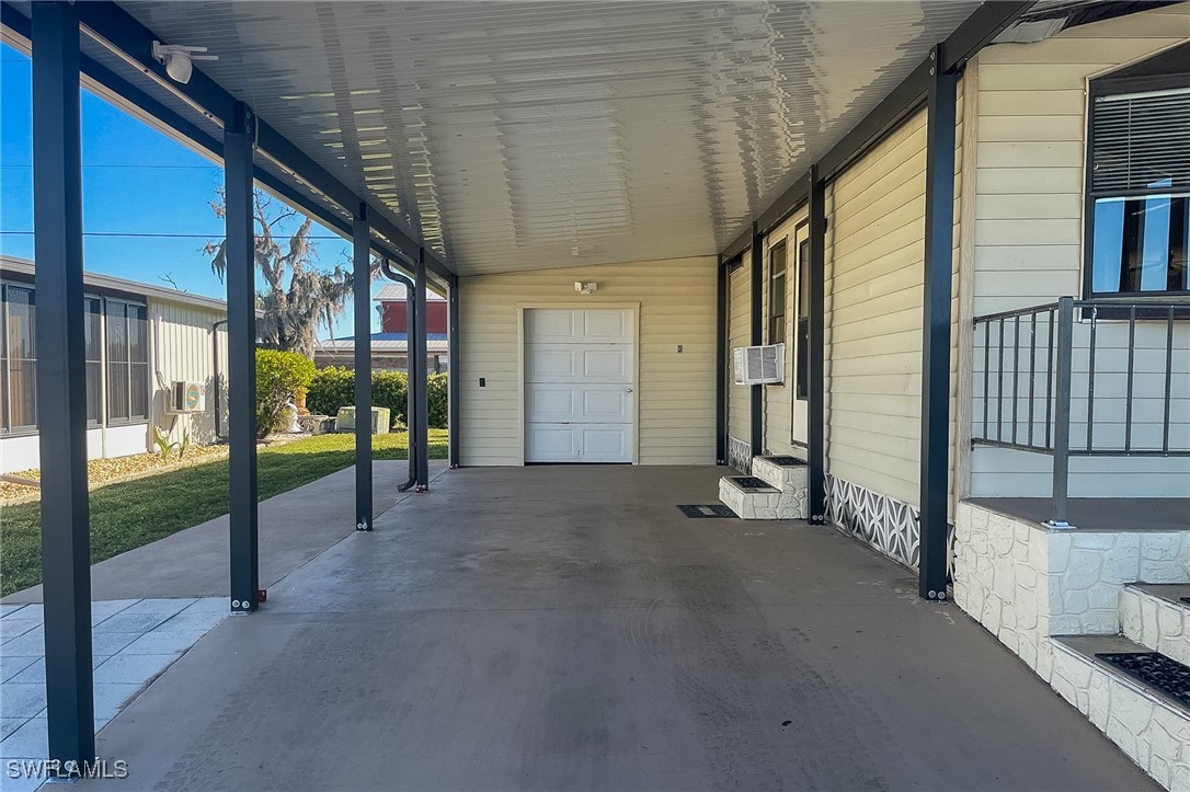 22 Ashe Alva, FL 33920 - Photo 9 of 42 a view of a porch with a table and chairs