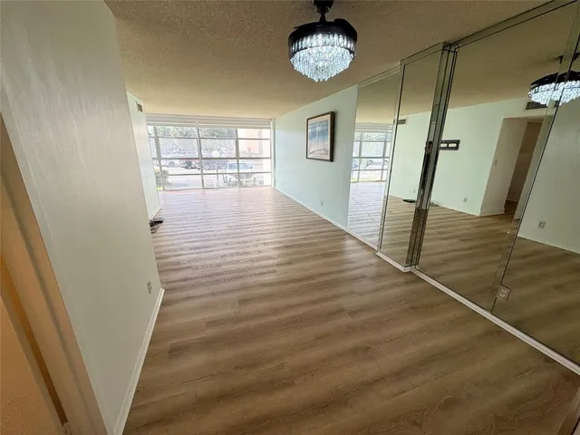 a view of an entryway with wooden floor