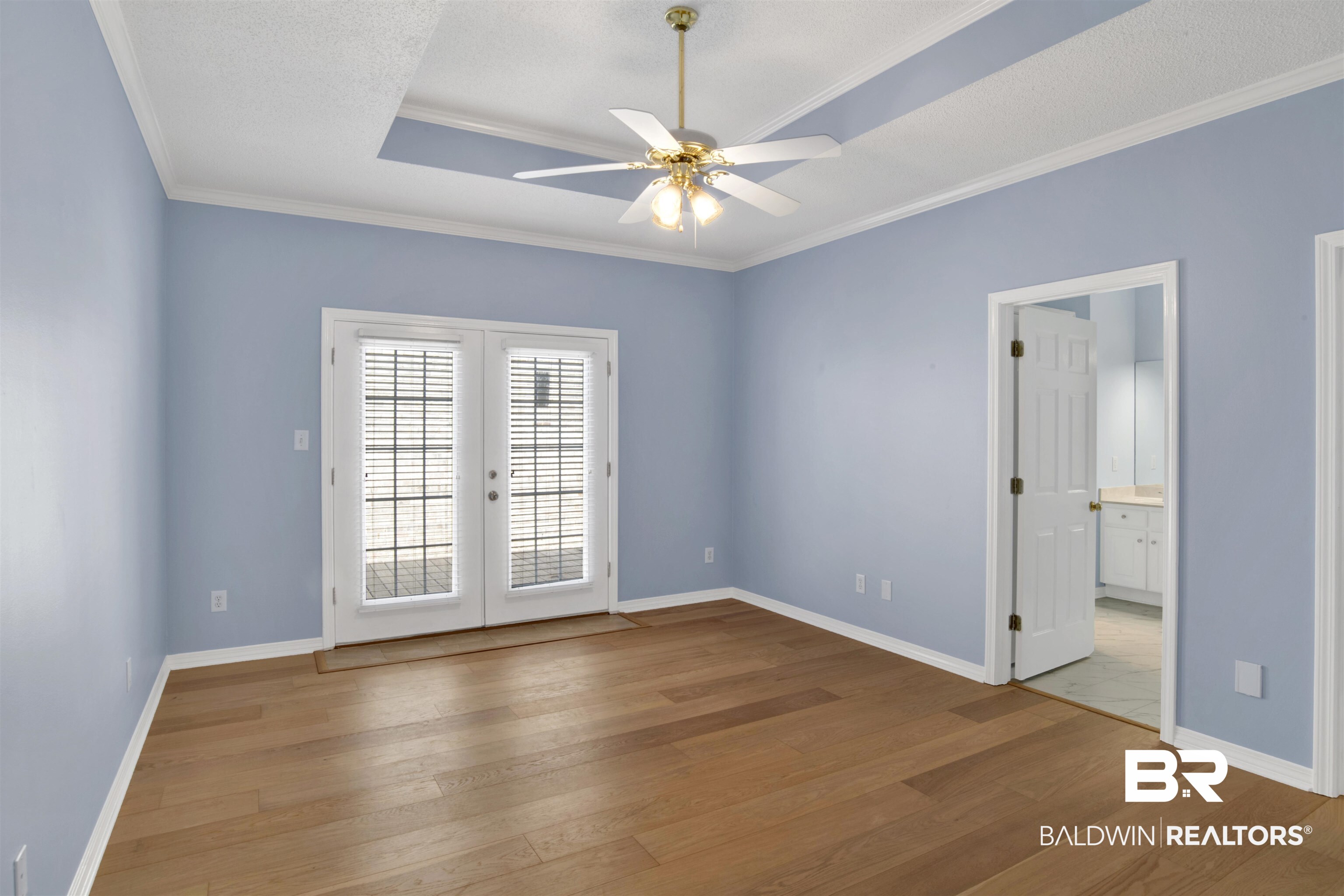 125 Woodruff Court Mobile, AL 36608 - Photo 15 of 27 Primary bedroom featuring french doors, crown molding, light hardwood / wood-style floors, and ceiling fan