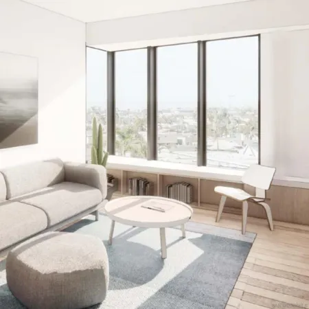 a living room with furniture and a potted plant