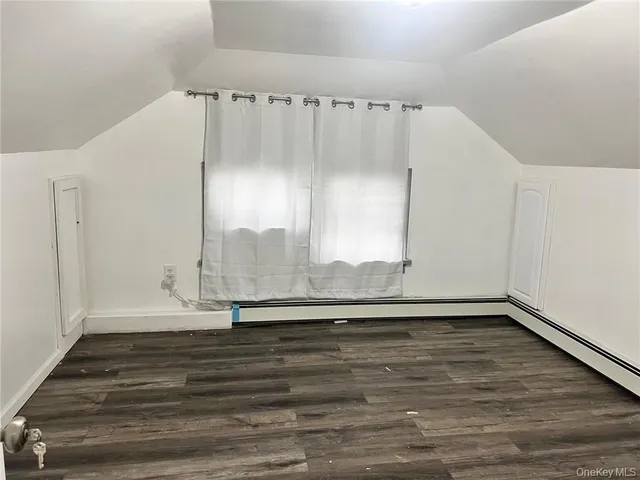 a bathroom with a sink toilet and mirror