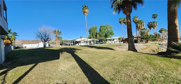 a view of a house with large space and a big yard