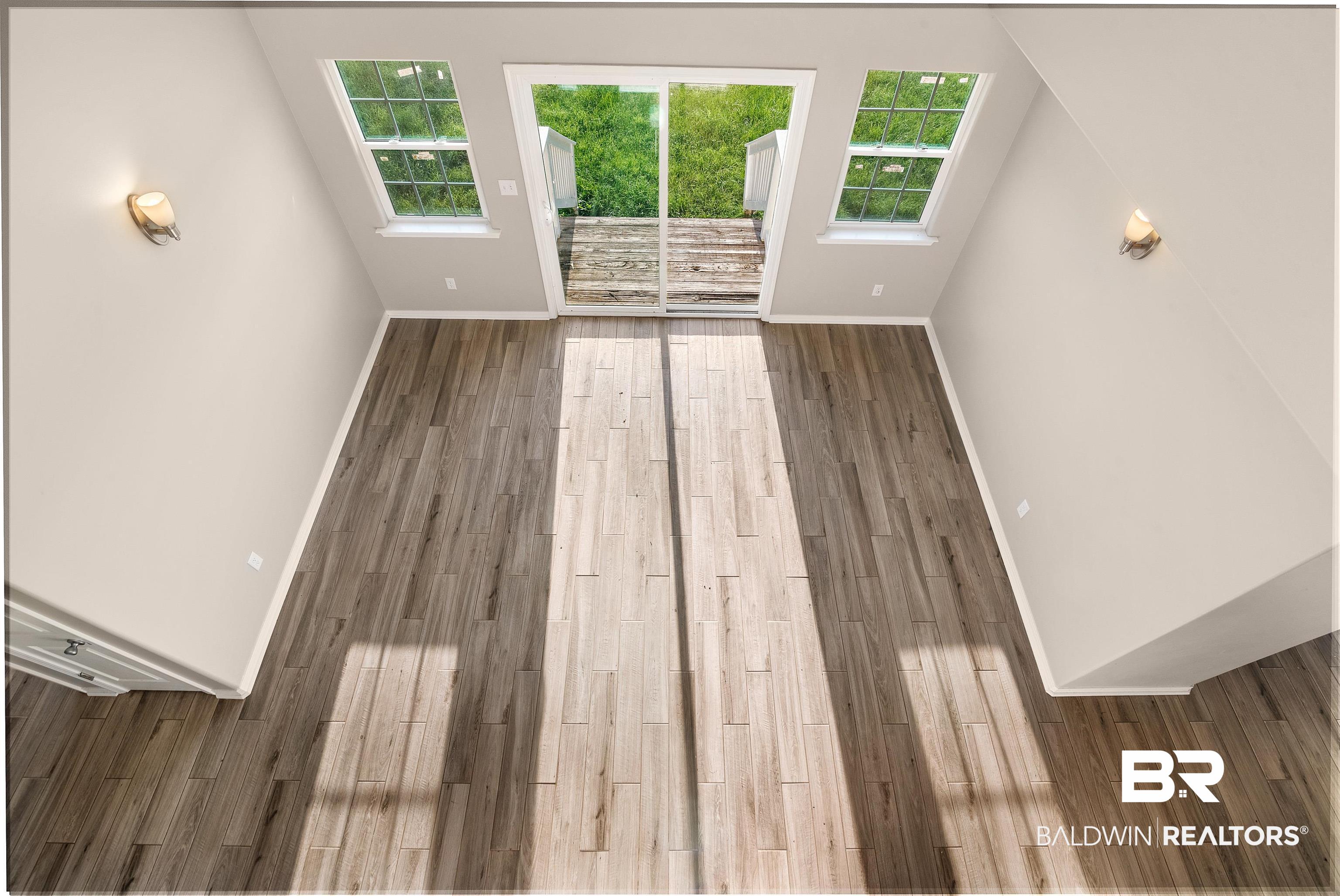 11889 Breman Road Elberta, AL 36530 - Photo 20 of 32 looks down into dining area