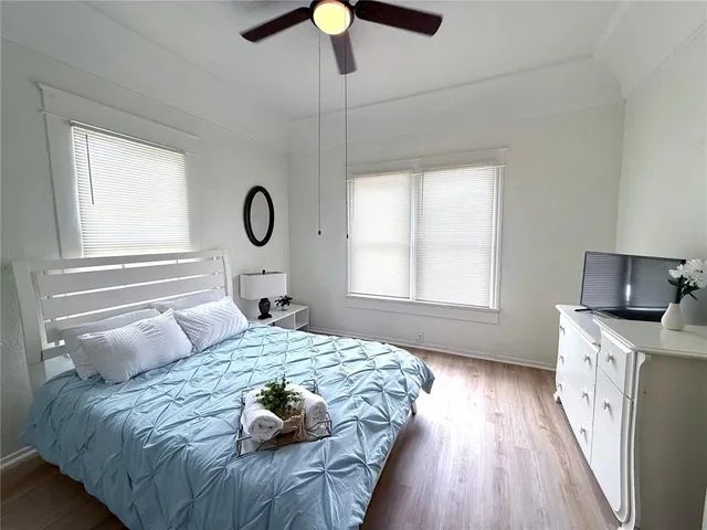 a bedroom with a bed and window