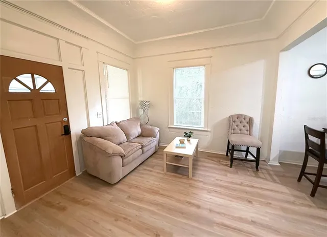 a living room with furniture and a window