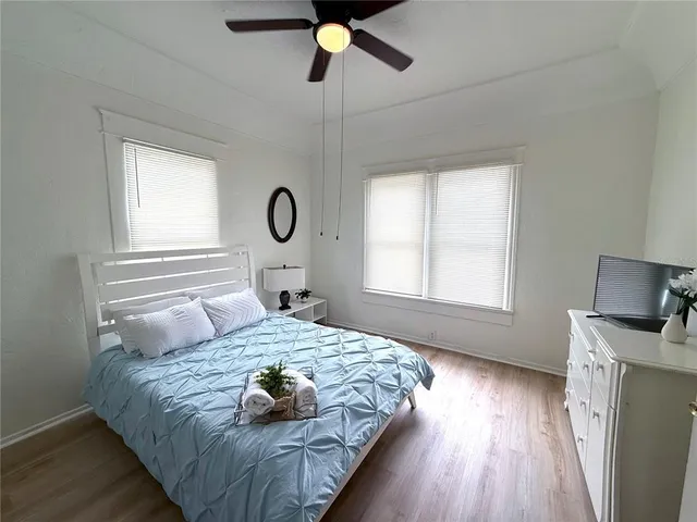 a bedroom with a bed and window