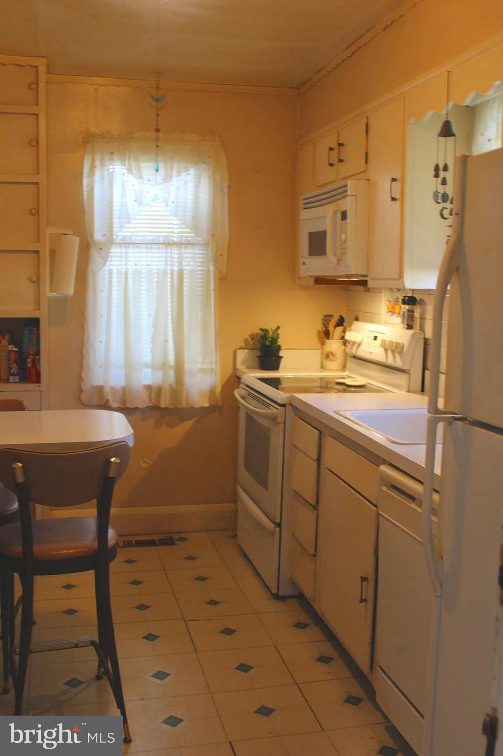 3015 Dunleer Road Baltimore, MD 21222 - Photo 15 of 18 a bathroom with a sink a window and a mirror