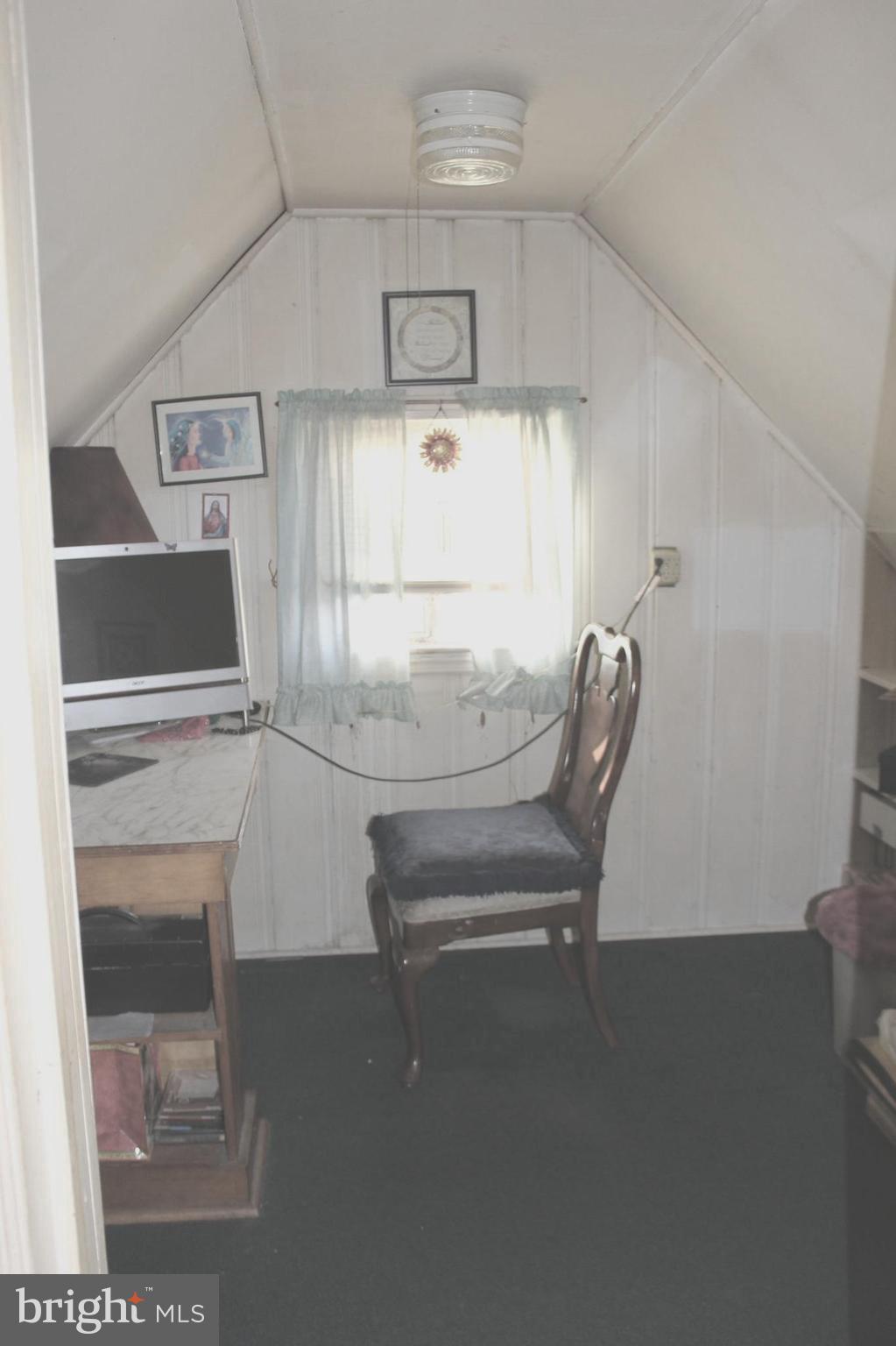 3015 Dunleer Road Baltimore, MD 21222 - Photo 7 of 18 a room with furniture and white walls