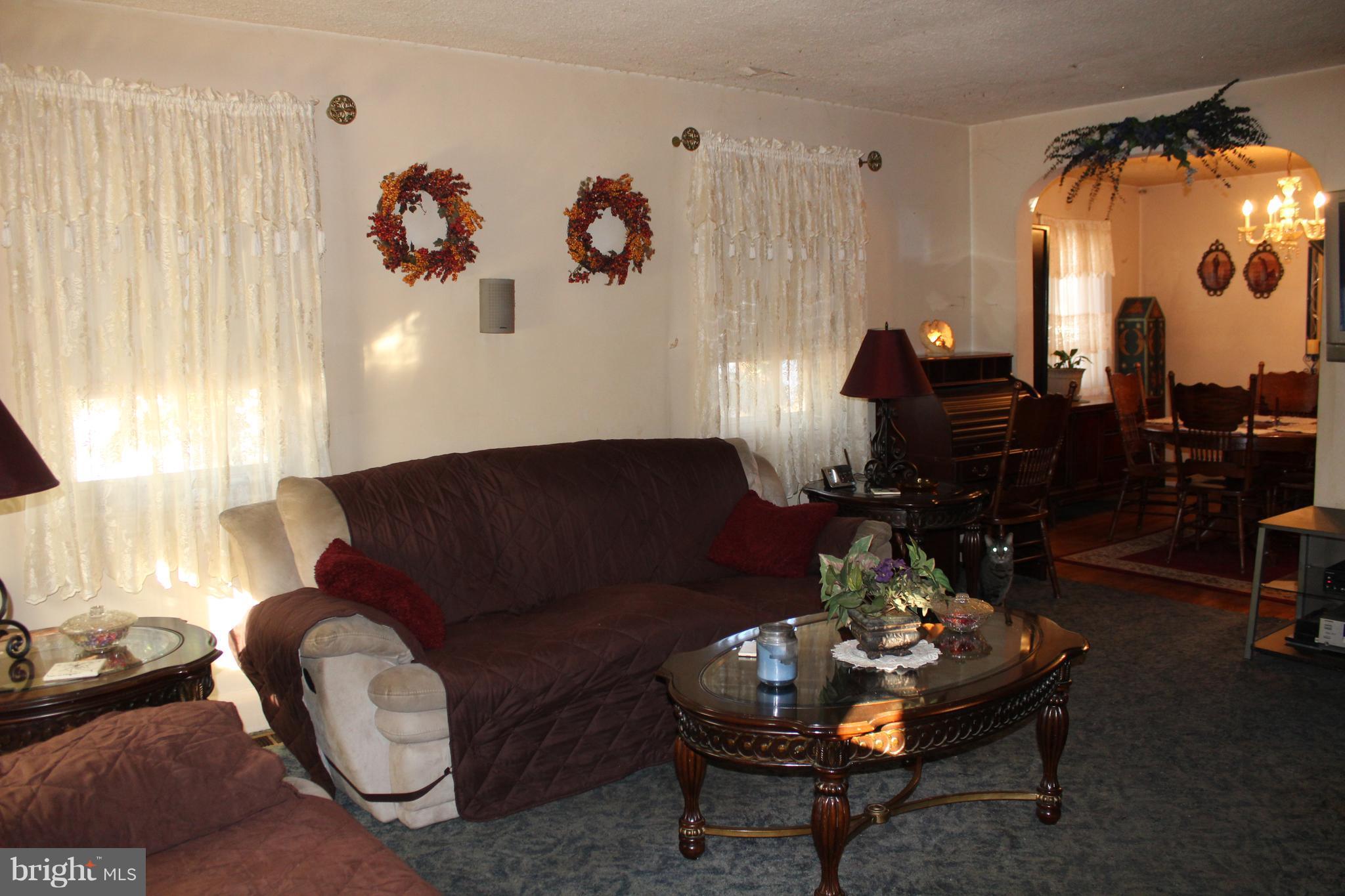 3015 Dunleer Road Baltimore, MD 21222 - Photo 9 of 18 a living room with furniture and a large window