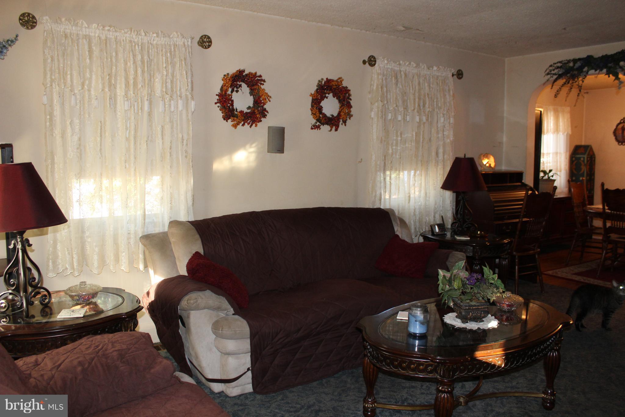 3015 Dunleer Road Baltimore, MD 21222 - Photo 10 of 18 a living room with furniture and a lamp