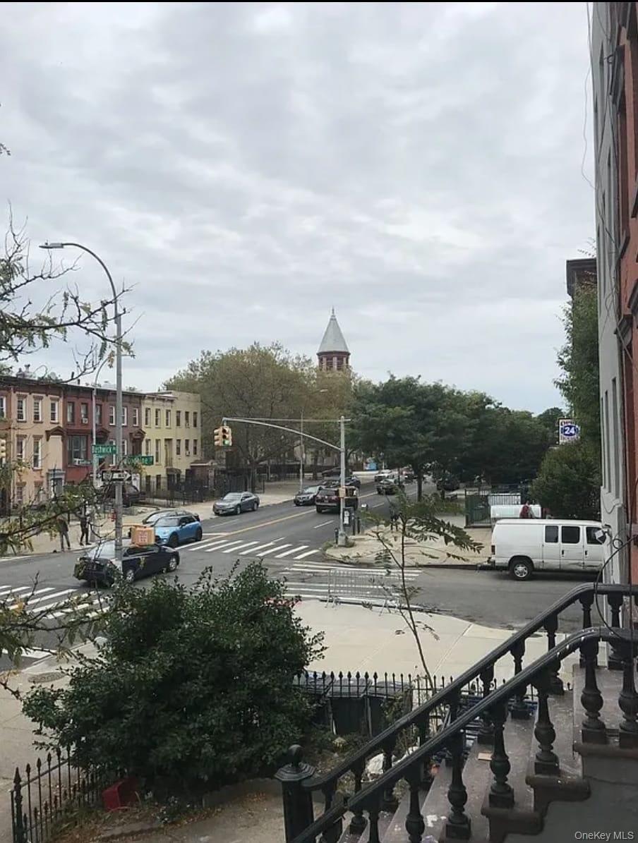1094 Bushwick Avenue Brooklyn, NY 11221 - Photo 7 of 9 a view of a tennis ground with large trees