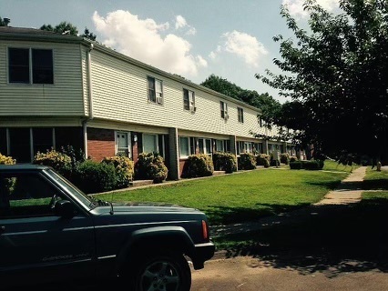 a front view of a house with a yard table and chairs