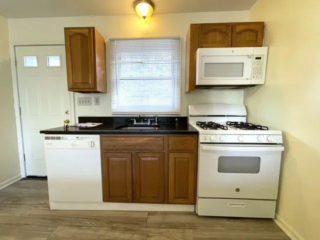 a kitchen with a stove and a microwave
