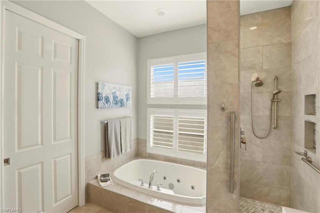 20441 Rookery Drive Estero, FL 33928 - Photo 22 of 41 a white bath tub sitting next to a shower
