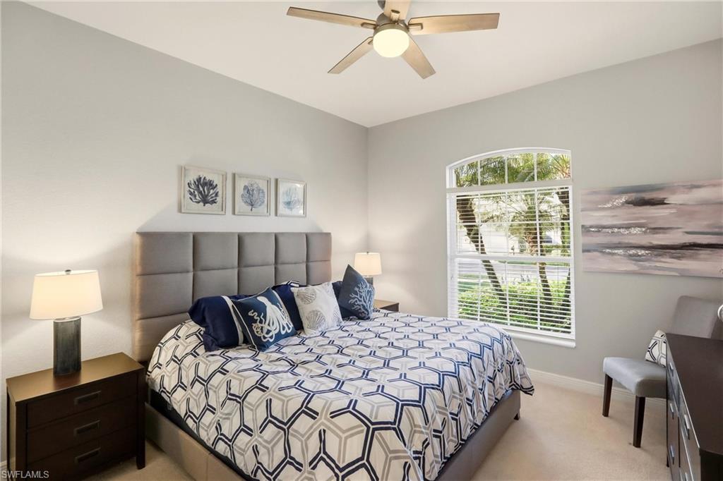 20441 Rookery Drive Estero, FL 33928 - Photo 23 of 41 a bedroom with a bed and window