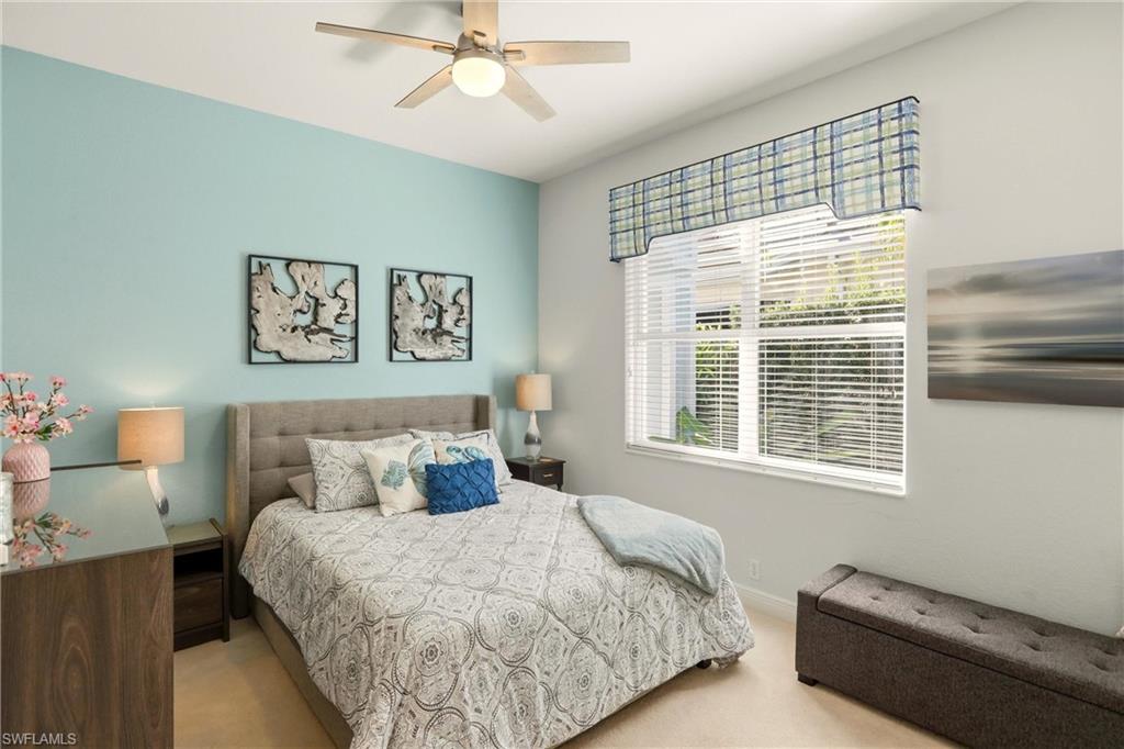 20441 Rookery Drive Estero, FL 33928 - Photo 24 of 41 a bedroom with a bed and a window