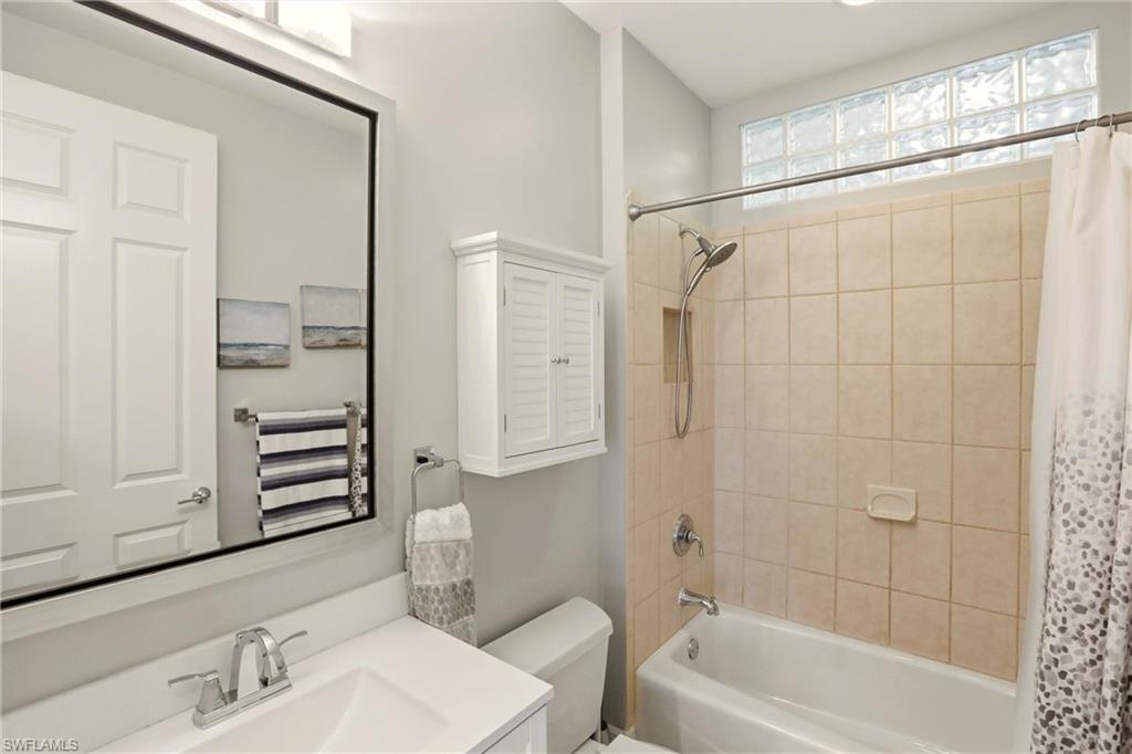 20441 Rookery Drive Estero, FL 33928 - Photo 25 of 41 a bathroom with a tub a sink and a mirror