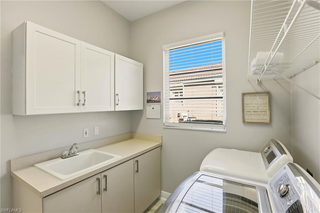 20441 Rookery Drive Estero, FL 33928 - Photo 28 of 41 a bathroom with a sink and a window