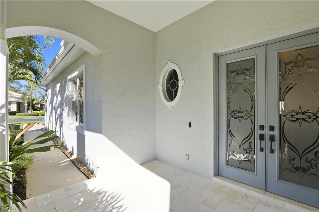 20441 Rookery Drive Estero, FL 33928 - Photo 3 of 41 a view of a hallway with entryway to windows