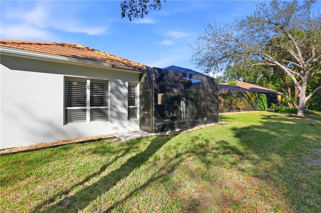20441 Rookery Drive Estero, FL 33928 - Photo 32 of 41 a view of a house with a yard