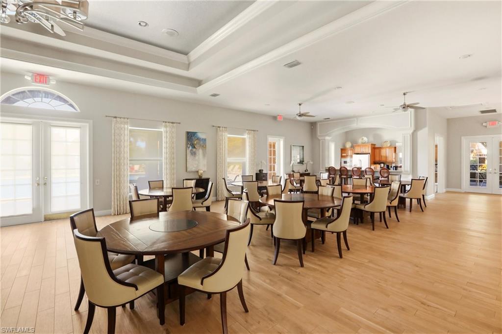 20441 Rookery Drive Estero, FL 33928 - Photo 34 of 41 a view of a dining room with furniture and wooden floor