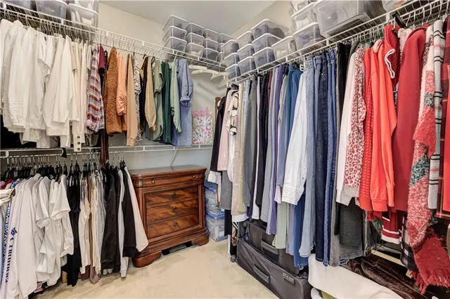 a front view of a house with swimming pool having outdoor seating