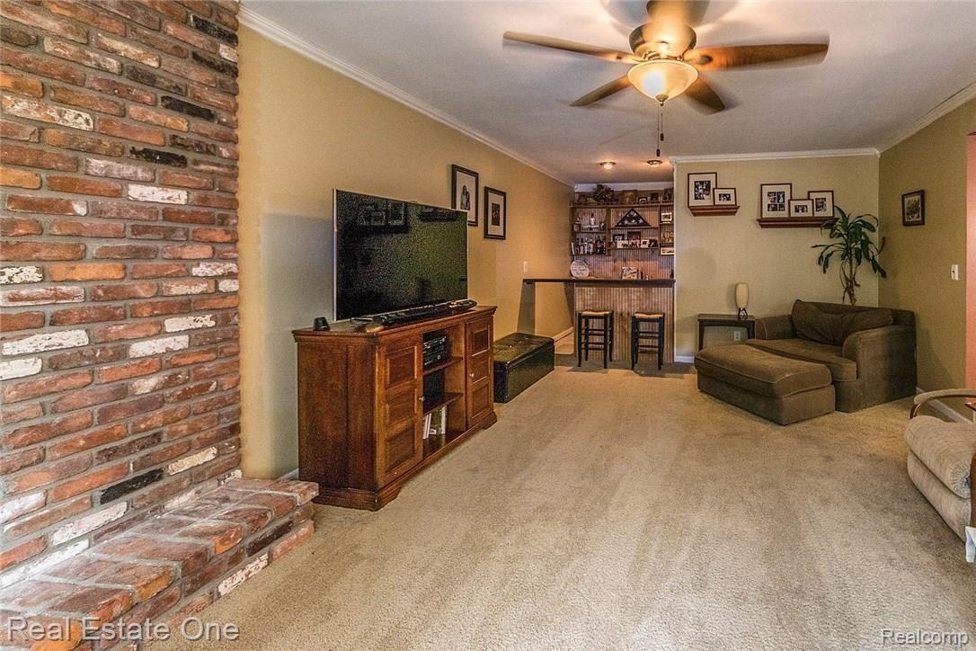 6127 Wedgewood Road Canton, MI 48187 - Photo 14 of 37 Great room with wet bar and brick mantle/ fireplace.