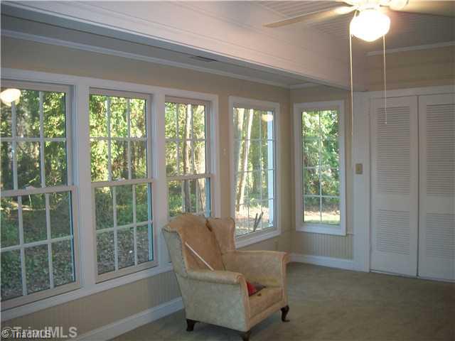 504 Ragsdale Road Jamestown, NC 27282 - Photo 8 of 12 Sunroom. Sunroom is not heated or cooled & therefore not included in square feet.