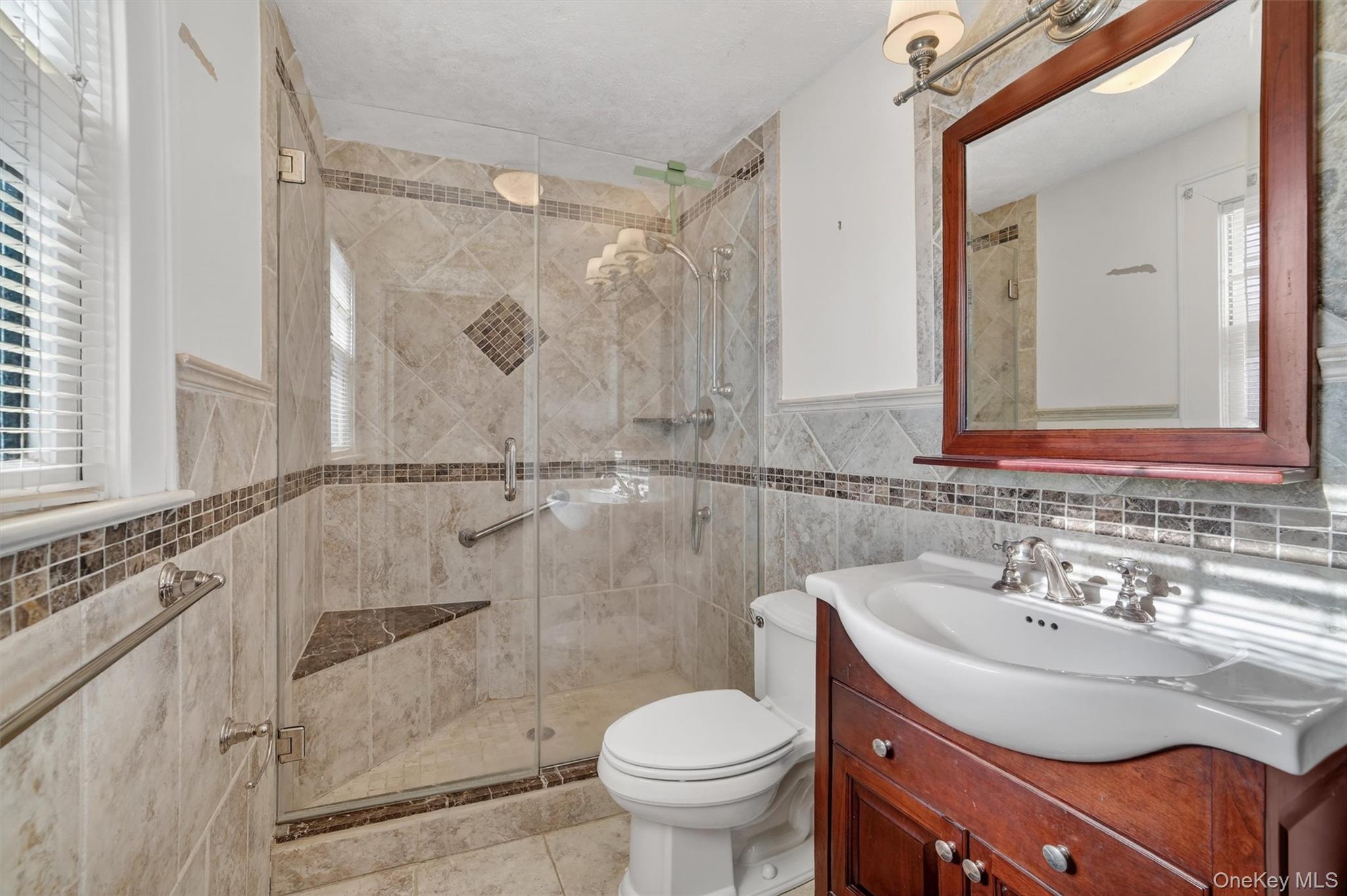 530 Dyckman Street Peekskill, NY 10566 - Photo 12 of 34 Full bathroom on the main level with a walk in shower.