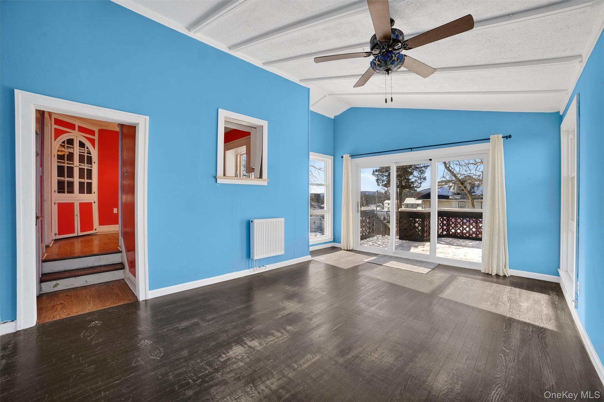 530 Dyckman Street Peekskill, NY 10566 - Photo 16 of 34 Sliding glass door leads to a multi level deck and backyard.