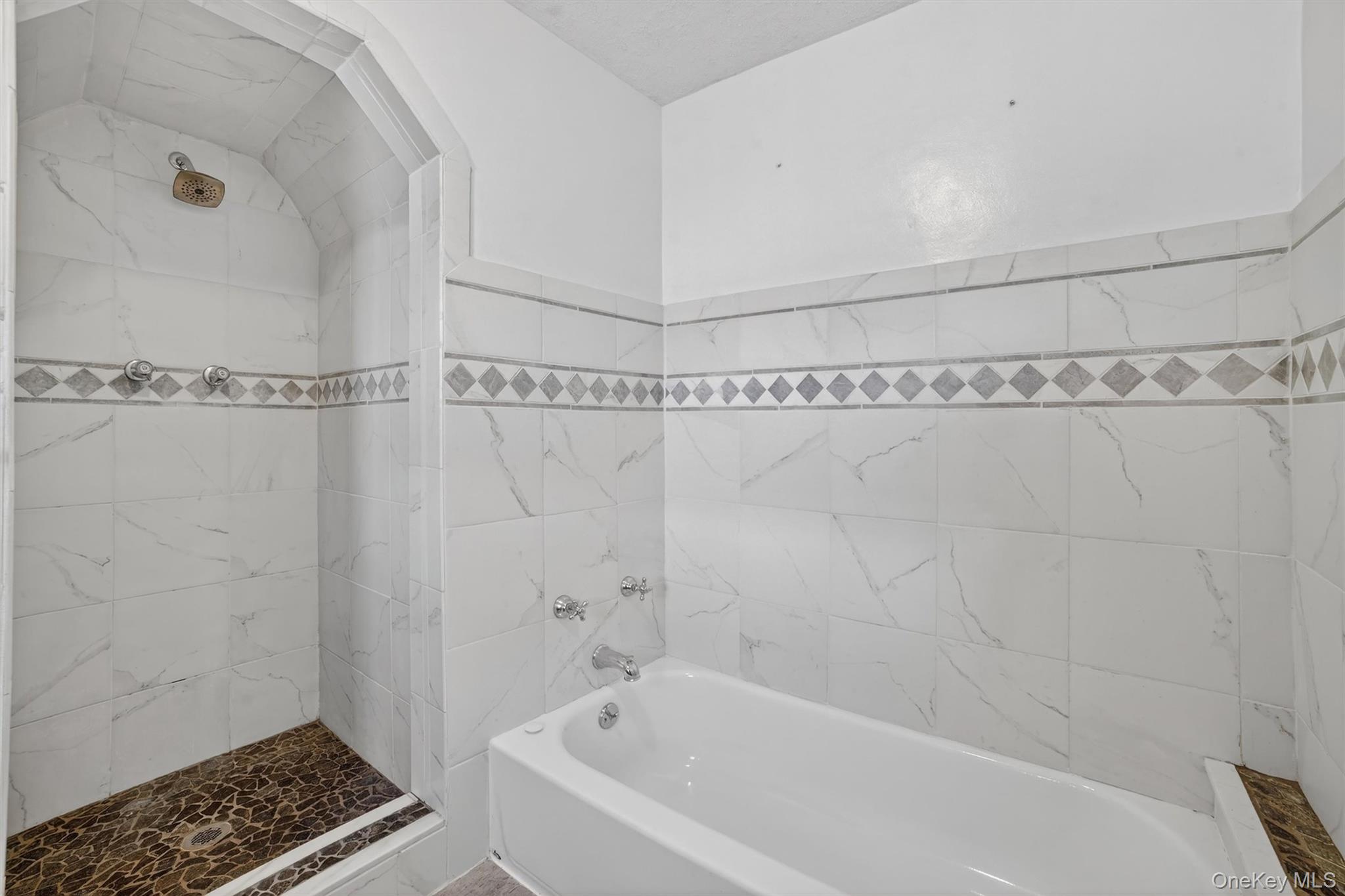530 Dyckman Street Peekskill, NY 10566 - Photo 22 of 34 Upper level bathroom with a shower and tub.