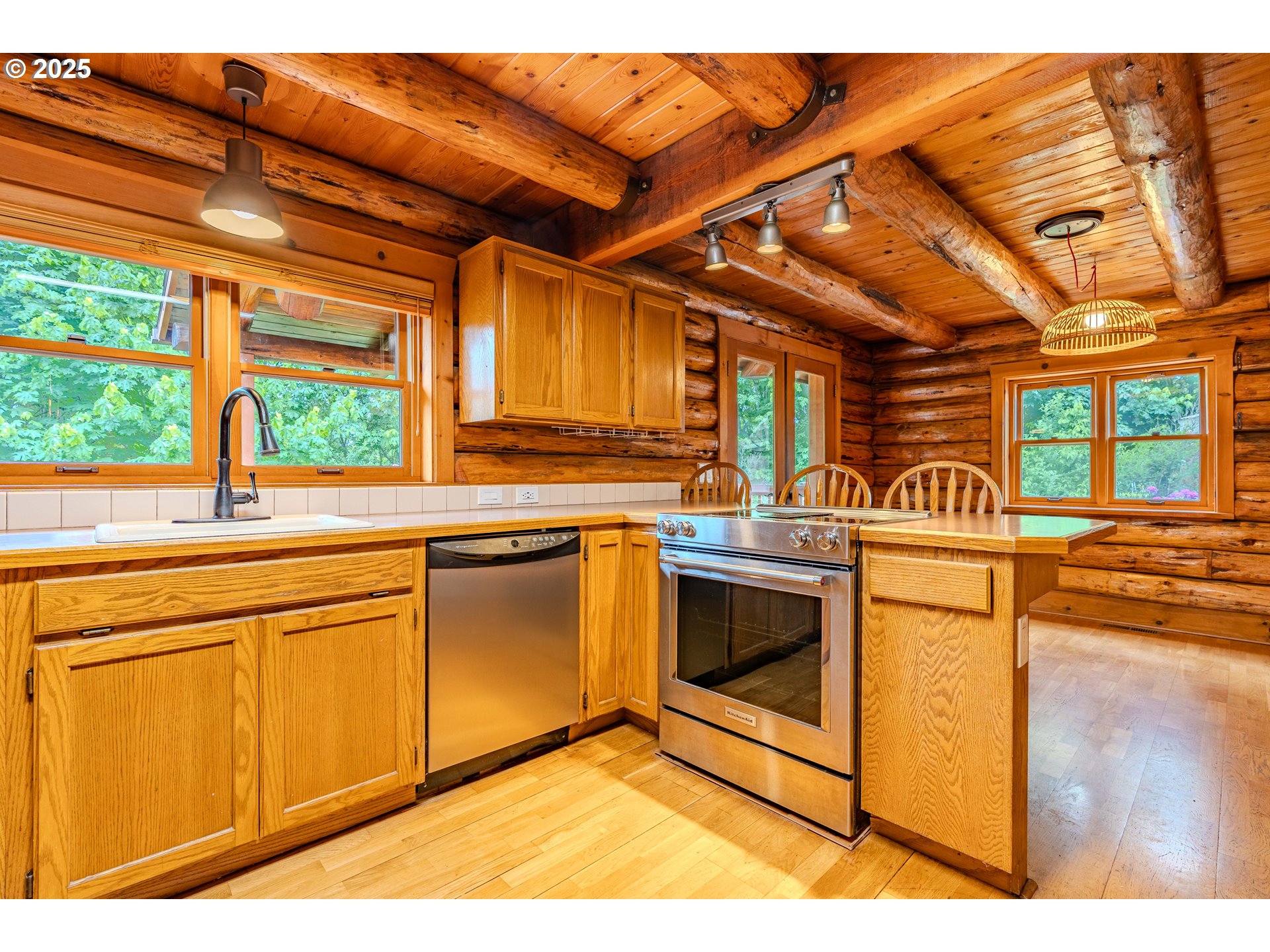 43144 Southeast Deverell Road Corbett, OR 97019 - Photo 14 of 48 a kitchen with stainless steel appliances granite countertop a stove a sink and a microwave
