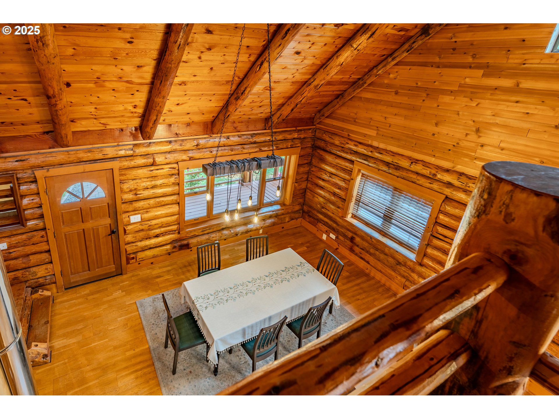 43144 Southeast Deverell Road Corbett, OR 97019 - Photo 18 of 48 a balcony with a table and chairs