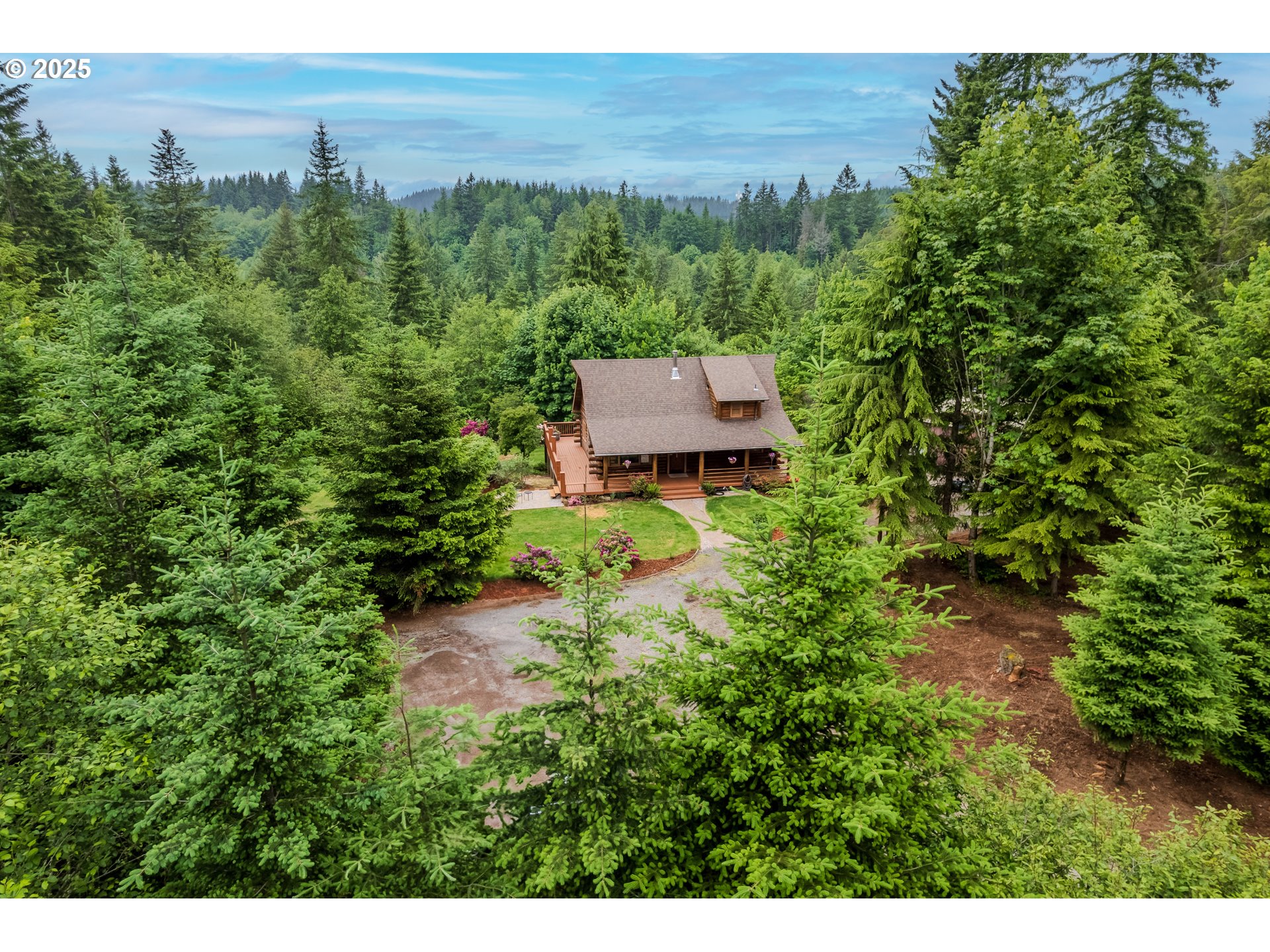 43144 Southeast Deverell Road Corbett, OR 97019 - Photo 2 of 48 a view of a garden with an outdoor space