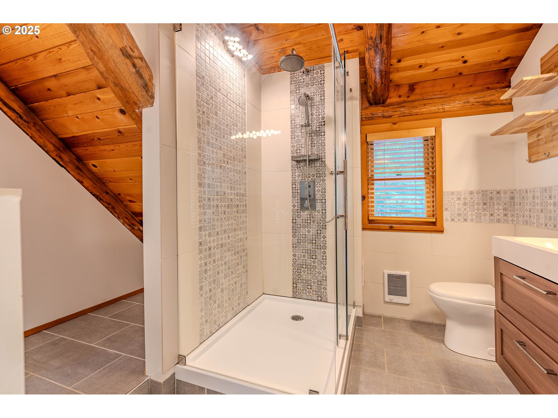 43144 Southeast Deverell Road Corbett, OR 97019 - Photo 21 of 48 a bathroom with a toilet a sink and a shower