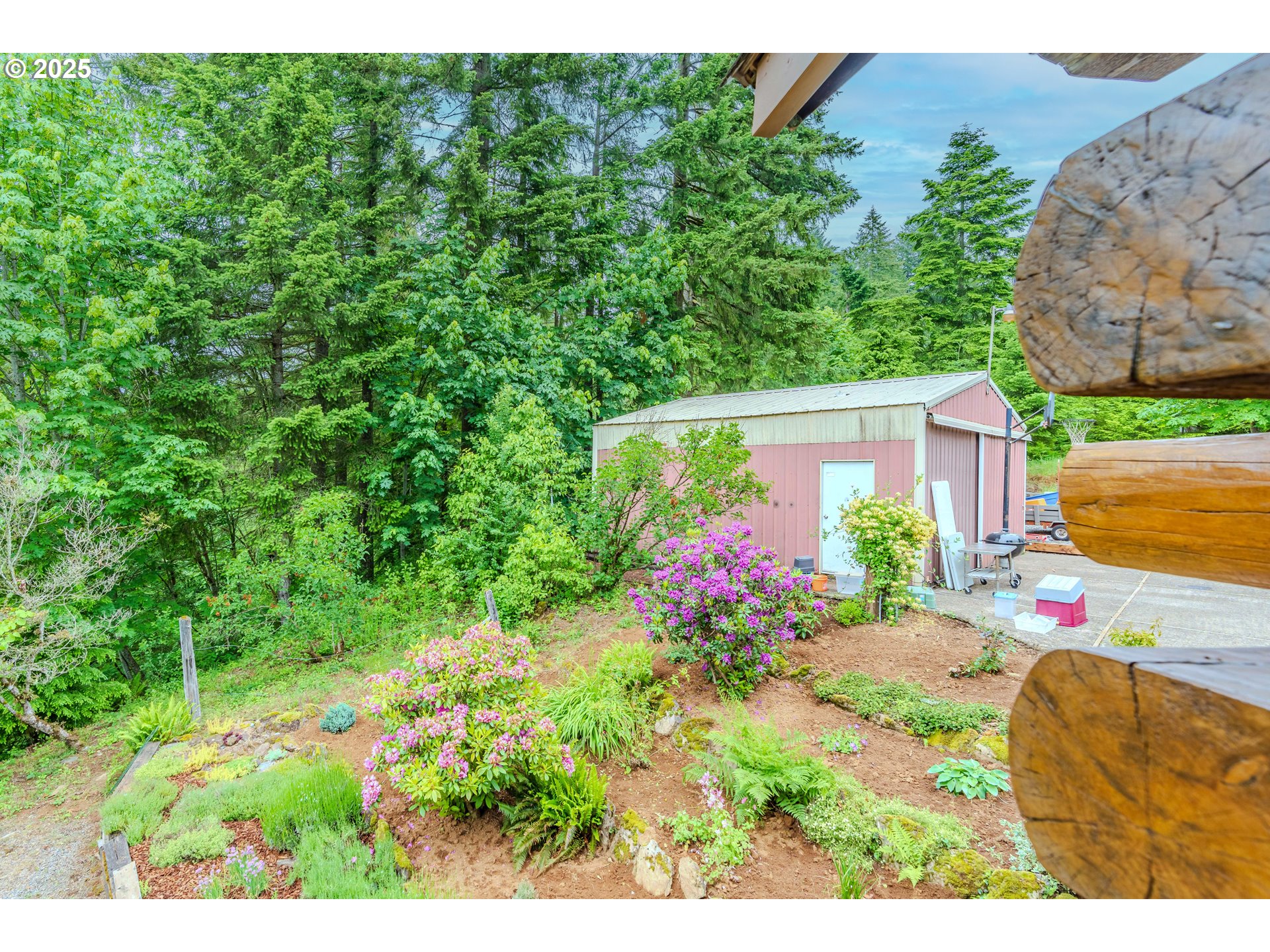 43144 Southeast Deverell Road Corbett, OR 97019 - Photo 31 of 48 a view of a house with a big yard and potted plants