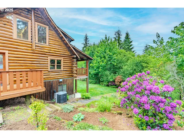 a backyard of a house with a garden and deck