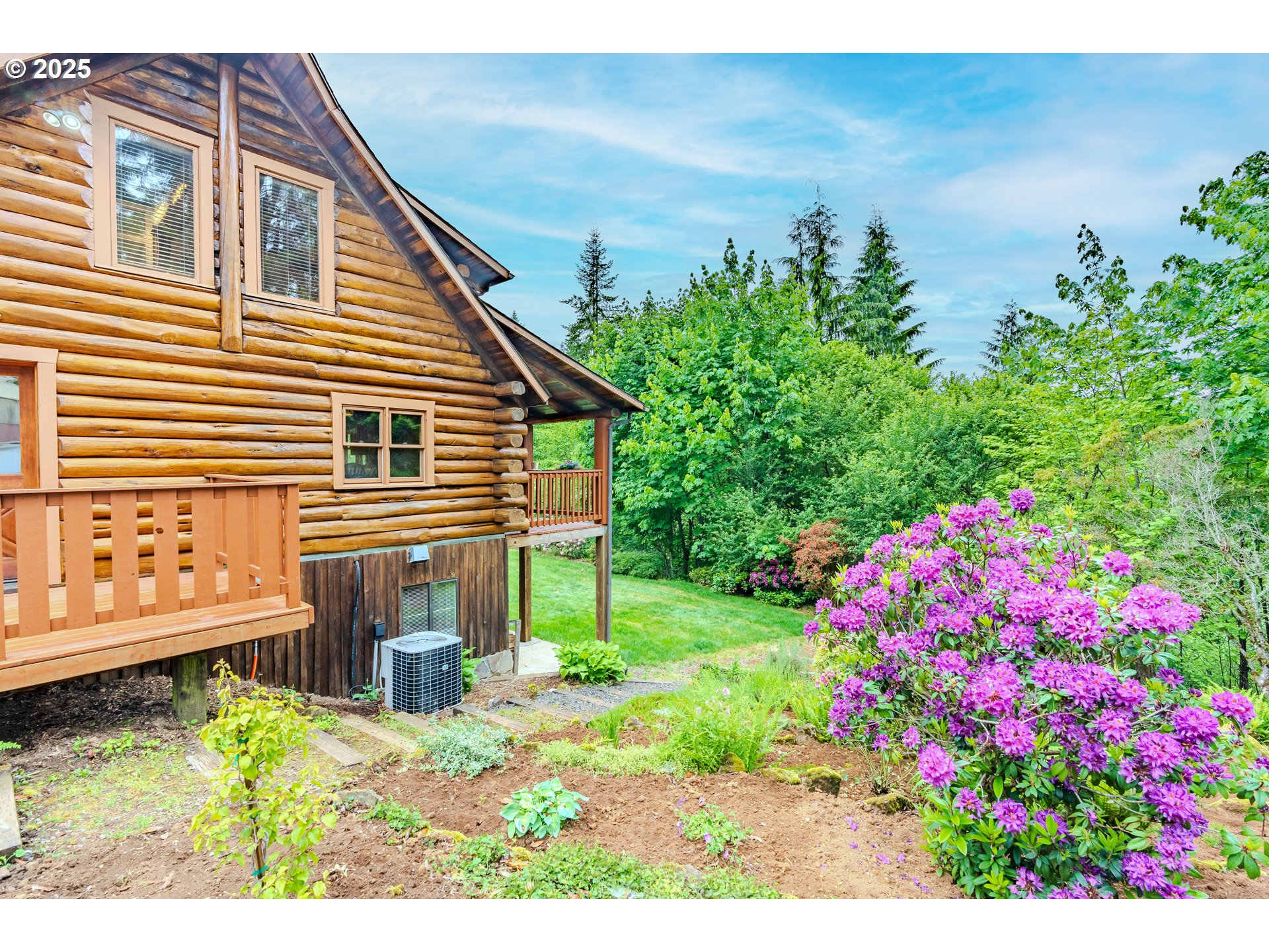 43144 Southeast Deverell Road Corbett, OR 97019 - Photo 36 of 48 a backyard of a house with a garden and deck