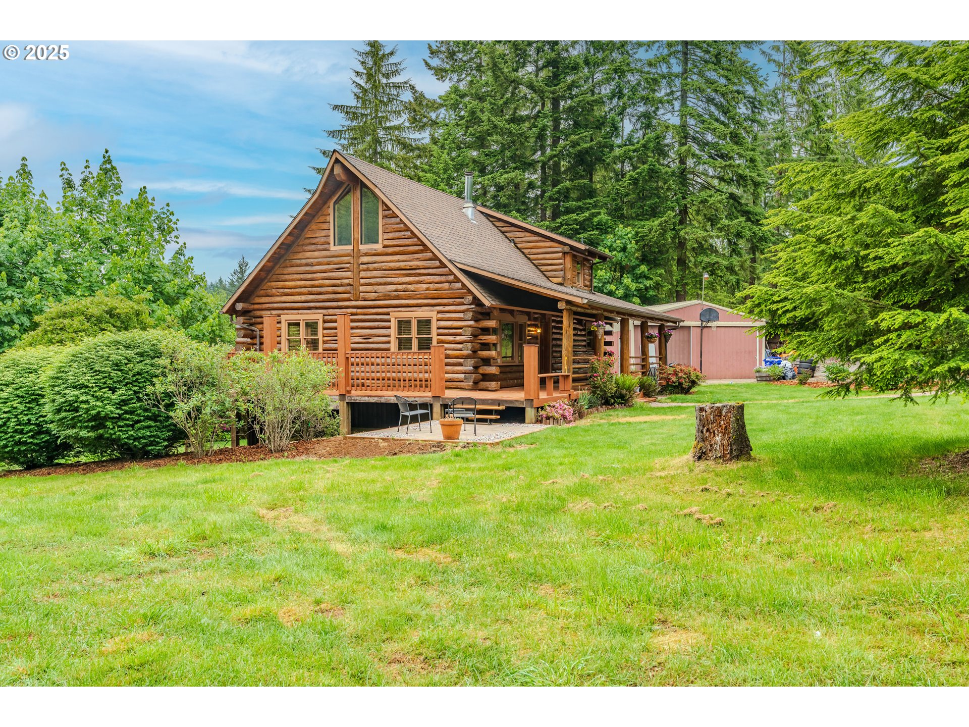 43144 Southeast Deverell Road Corbett, OR 97019 - Photo 38 of 48 a view of a house with a yard and sitting area